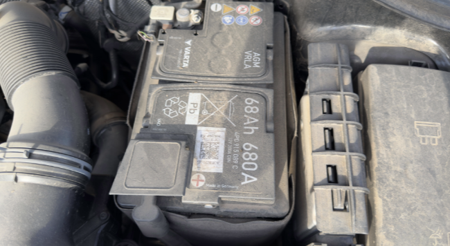 Manufacturing date code on a new car battery during pre-delivery inspection